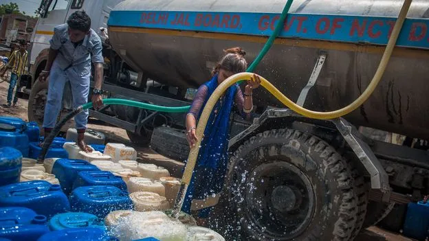 Clear municipal drinking water running from pipe